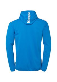 Blue hooded jacket made from lightweight fabric. Features white accents on shoulders and large "Kempa" logo on the back. Smooth texture.