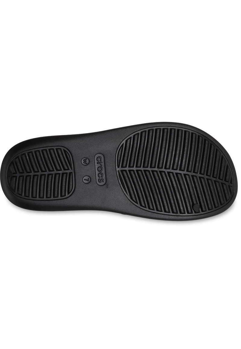 Semelle en caoutchouc noir avec un motif de traction texturé, présentant le logo du fabricant et les indications de taille moulées dans le matériau.