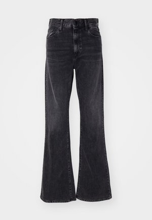 Jeans a zampa d'elefante in denim nero con vita alta, design a cinque tasche e un leggero effetto sbiadito. L'orlo è leggermente sfilacciato, aggiungendo un tocco di texture.