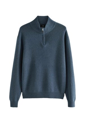 Sötétkék, kötött pulóver, magas bordázott gallérral és rövid cipzárral. Hosszú ujjakkal, bordázott mandzsettával és szegéllyel rendelkezik.