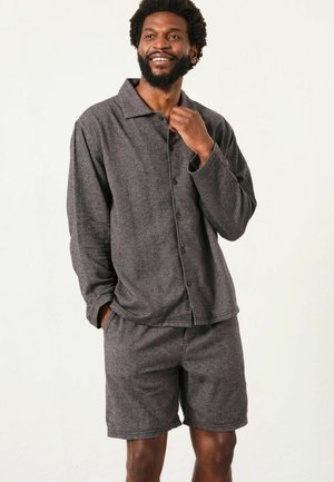 Gray loungewear set featuring a collared long-sleeve button-up shirt and matching shorts, both in a soft, textured fabric.