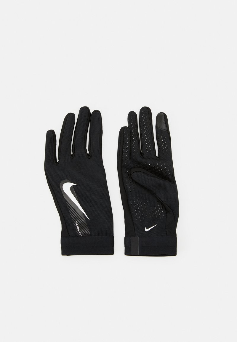 Black athletic gloves made of textured fabric, featuring a reflective Nike logo and patterned grip on fingers for enhanced handling.