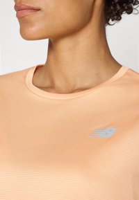 New Balance ESSENTIALS - Športové tričko - dried orange