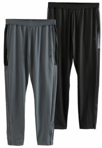 Dos pares de pantalones deportivos: uno en gris oscuro con detalles en negro y otro completamente negro. Ambos cuentan con una cintura elástica y tela delgada.