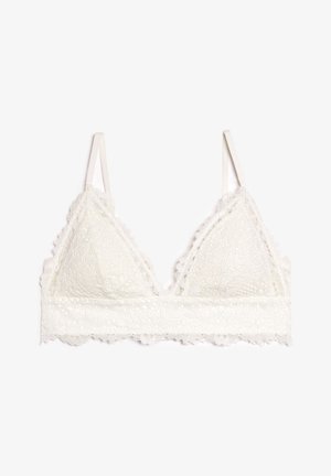 Bralette in pizzo color crema, con forma triangolare, bordi smerlati, spalline regolabili e una larga fascia di pizzo sotto il busto.