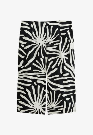 Svarta shorts med ett djärvt vitt abstrakt mönster med strålande former. Tillverkade av mjukt tyg, skräddarsydd passform och knälång design.