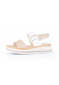 Beige and white platform sandals with a glossy finish, adjustable buckle, and textured sole. Features a subtle layered design.