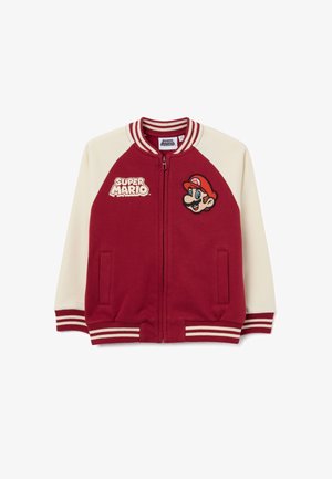 Red and cream zip-up jacket with striped cuffs, Super Mario logo on left chest, and embroidered Mario face on right chest.