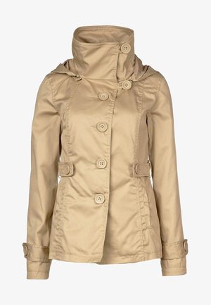 Beige dameskjortejakke med høj krave, talje stropper, lange ærmer og manchetter med knapper, lavet af glat stof.
