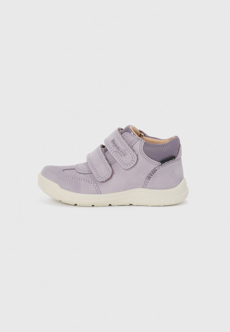 Purple suede children's shoes with two velcro straps, a contrasting fabric heel, and a white rubber sole. Rounded toe design.