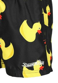 Pantaloni da bagno neri con motivi di paperelle gialle, dotati di logo sull'orlo. Realizzati in tessuto leggero con una superficie liscia.