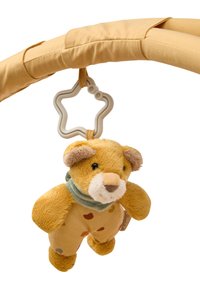 Plush lion toy in yellow, wearing a polka-dot outfit. Features soft fabric, a light green scarf, and a star-shaped attachment ring.