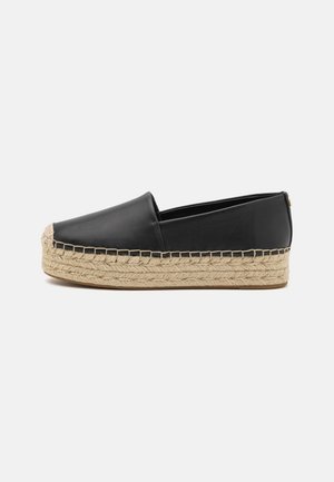 Black leather espadrille shoe featuring a woven jute sole. Smooth surface with a rounded toe and a decorative stitching detail.
