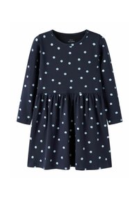 Granatowa sukienka z długim rękawem w jasnoniebieskie kropki, z okrągłym dekoltem, marszczonym pasem i rozkloszowanym dołem. Wykonana z miękkiej bawełny.