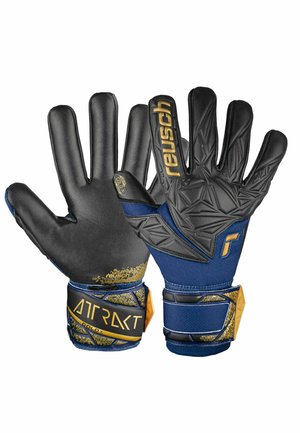 Black goalkeeper gloves with textured grip, featuring a navy and gold elastic cuff. Includes brand logo and grip technology details.