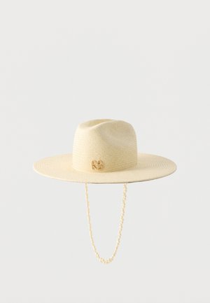 Beige wide-brim straw hat with a rounded crown, small logo detail on the side, and a pearl-adorned chin strap hanging below.