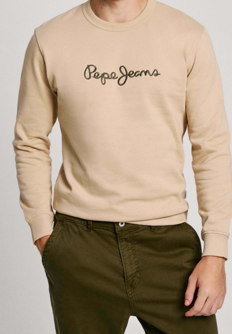 Beige sweatshirt made of cotton blend, featuring a round neck and long sleeves, with "Pepe Jeans" embroidered in dark green on the chest.