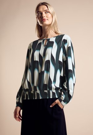 Langärmlige Bluse aus leichtem Stoff mit einem auffälligen abstrakten Muster in Blaugrün, Schwarz und Creme, mit einem Schlüsselloch-Ausschnitt und einem gerafften Saum.