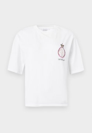 Fehér pamut póló rózsaszín és fekete hímzett koronás logóval, kerek nyakkivágással és bővebb szabással. Rövid ujjú, egyenes szegéllyel.