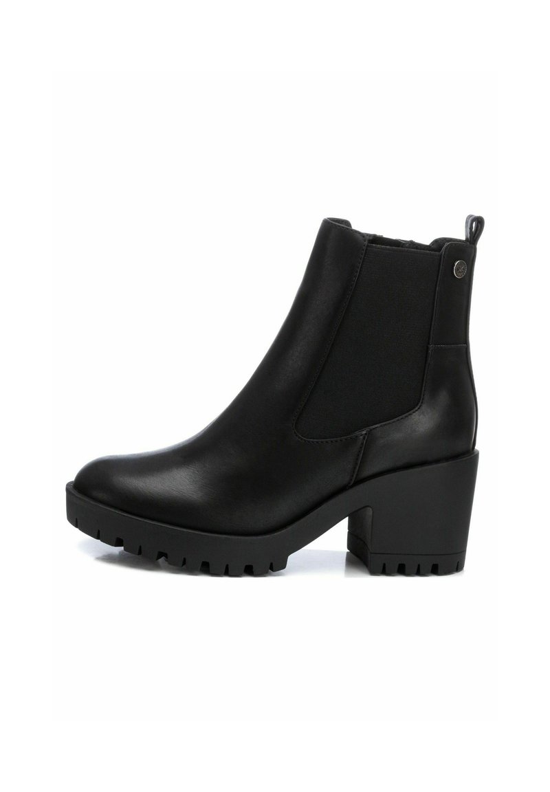 Black ankle boots with a smooth leather material, elastic side panels, a chunky block heel, and a textured rubber sole.
