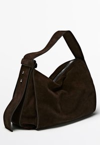 Dark brown suede shoulder bag with wide adjustable strap and silver zipper closure, soft and slouchy shape.