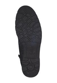 Talpă de cauciuc neagră cu modele texturate pentru prindere, având un detaliu de design rotund și brandul "Gabor" aproape de toc.