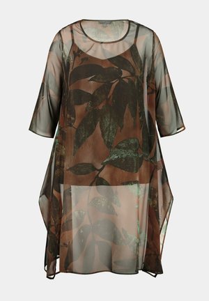 Tunique transparente marron à coupe ample, ornée d'un motif de feuilles vertes. Elle possède un col rond et des manches trois-quarts.