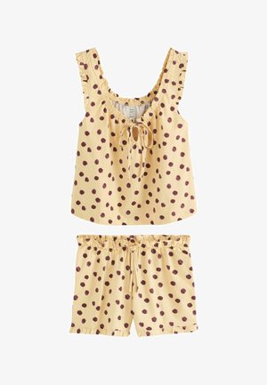 Haut sans manches jaune clair et short avec des pois marron, bords froncés et cordons ajustables au col et à la taille.