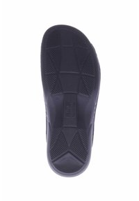 Shoe sole in black rubber featuring a textured grip pattern with geometric shapes and branding. Size 36 visible on the sole.