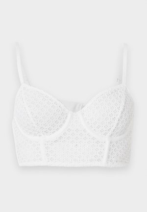 Λευκό μακρύ δαντελένιο σουτιέν με ενισχυμένα cups και ρυθμιζόμενα τιραντάκια σε απλό φόντο.