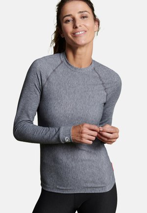 Grijze lange mouwen sportshirt gemaakt van een gladde stof. Kenmerkt zich door raglanmouwen, een ronde hals en subtiele stikdetails.