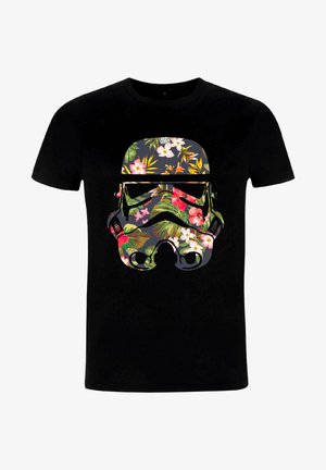Black cotton T-shirt featuring a large floral pattern in vibrant colors shaped like a stormtrooper helmet on the front.