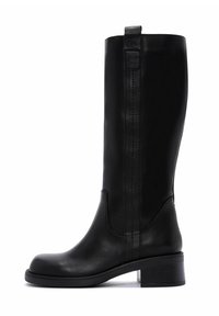 Bottes noires en cuir jusqu'au genou avec un bout rond, un minimum de coutures et un talon carré pour plus de stabilité. Présente une tirette pour un enfilage facile.