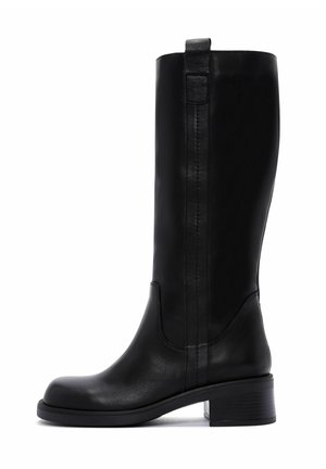 Bottes noires en cuir jusqu'au genou avec un bout rond, un minimum de coutures et un talon carré pour plus de stabilité. Présente une tirette pour un enfilage facile.