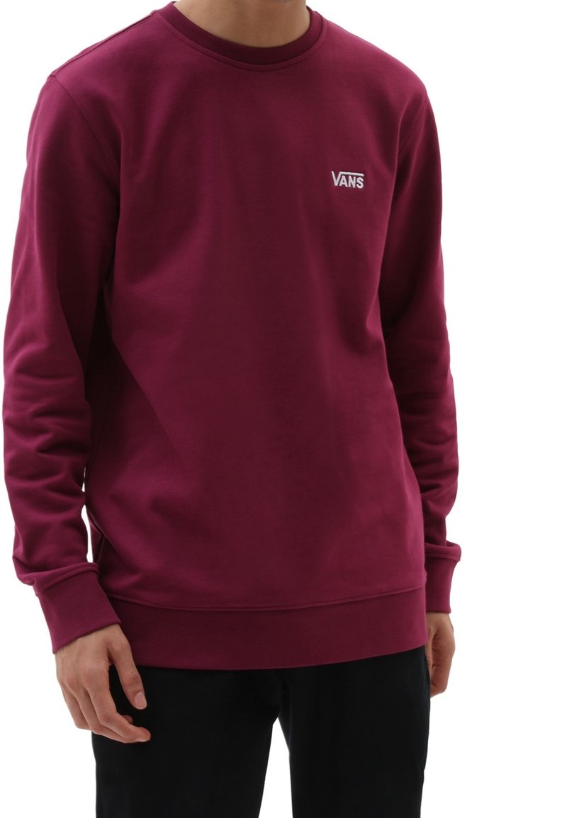 Felpa bordeaux realizzata in tessuto misto cotone, con maniche lunghe, polsini a coste e un piccolo logo Vans bianco sul petto.
