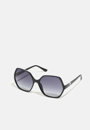Black octagonal sunglasses with gradient gray lenses. Features include sleek frame design and minimal hardware accents on the arms.