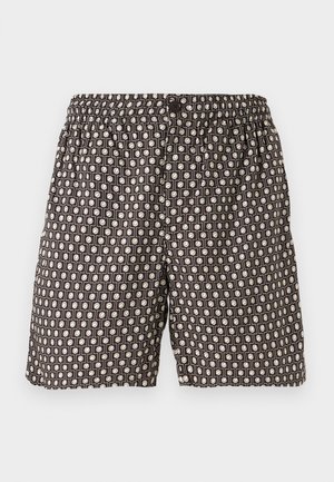 Pantaloni shorts neri con un motivo geometrico in crema. Presentano una vita elastica e un bottone, realizzati in tessuto leggero.