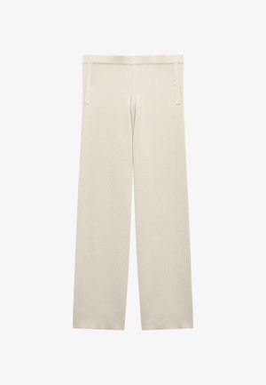 Beżowe spodnie o szerokich nogawkach, wykonane z miękkiego materiału. Posiadają gładką fakturę, elastyczny pas oraz ściągacze przy kostkach.