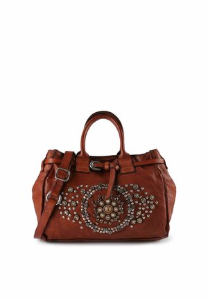 Bruine leren handtas met dubbele bovenhandgrepen en een afneembare schouderriem. Voorzien van cirkelvormige metalen versieringen aan de voorkant.
