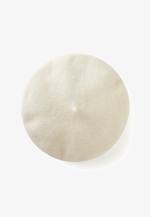 Soft, round white wool beret with a small central nub, isolated on a white background.