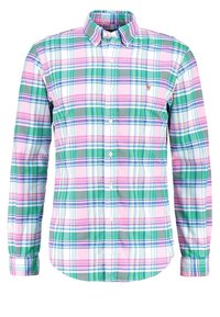 Langärmad skjorta med krage i rutigt mönster med färgerna grön, rosa, vit och blå. Tillverkad av bomull med knäppning fram.
