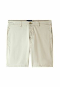 Ljusbeiga shorts gjorda av mjuk tyg. Har en framknappsstängning, bältesöggor och två sidofickor.