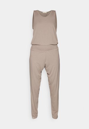 Beige jumpsuit made of soft fabric, featuring a sleeveless top and elastic waist pants with a loose fit and tapered legs.