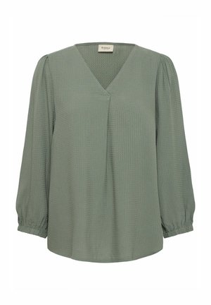 Grüne Bluse mit V-Ausschnitt, langen Puffärmeln und strukturiertem Stoff. Verfügt über weich gefaltete Details an der Vorderseite und elastische Bündchen.