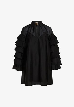 Must mustärk särk kõrge kraega, millel on kihilised volangpüüdjad ja vabalt langev lõige. Sile, kerge kangas, millel on kerge läige.