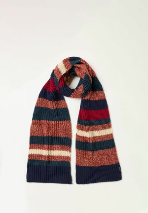 Bufanda de punto con amplias franjas horizontales en azul marino, rojo, crema, óxido y verde azulado, doblada con un extremo apoyado junto al otro.