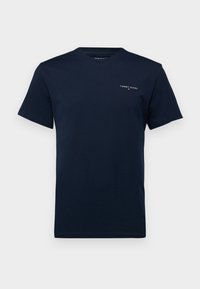 Granatowy bawełniany T-shirt z krótkimi rękawami i okrągłym dekoltem. Na piersi małe białe logo „TOMMY JEANS”. Płaski dół.