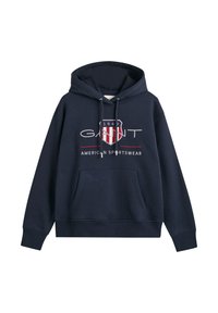Marine hoodie gemaakt van katoenmixstof. Heeft een kangoeroezak, capuchon met trekkoord en een logo schild met rood-witte strepen.