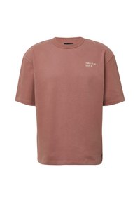 Rosa übergroßes T-Shirt aus Baumwolle mit kurzen Ärmeln und rundem Halsausschnitt. Auf der Brust befindet sich weißer Text: "Nimm es oder lass es."