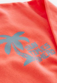 Next PRINTED  - Pusa - coral pink